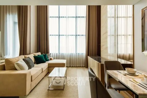 Luxurious modern living room with elegant decor and large windows