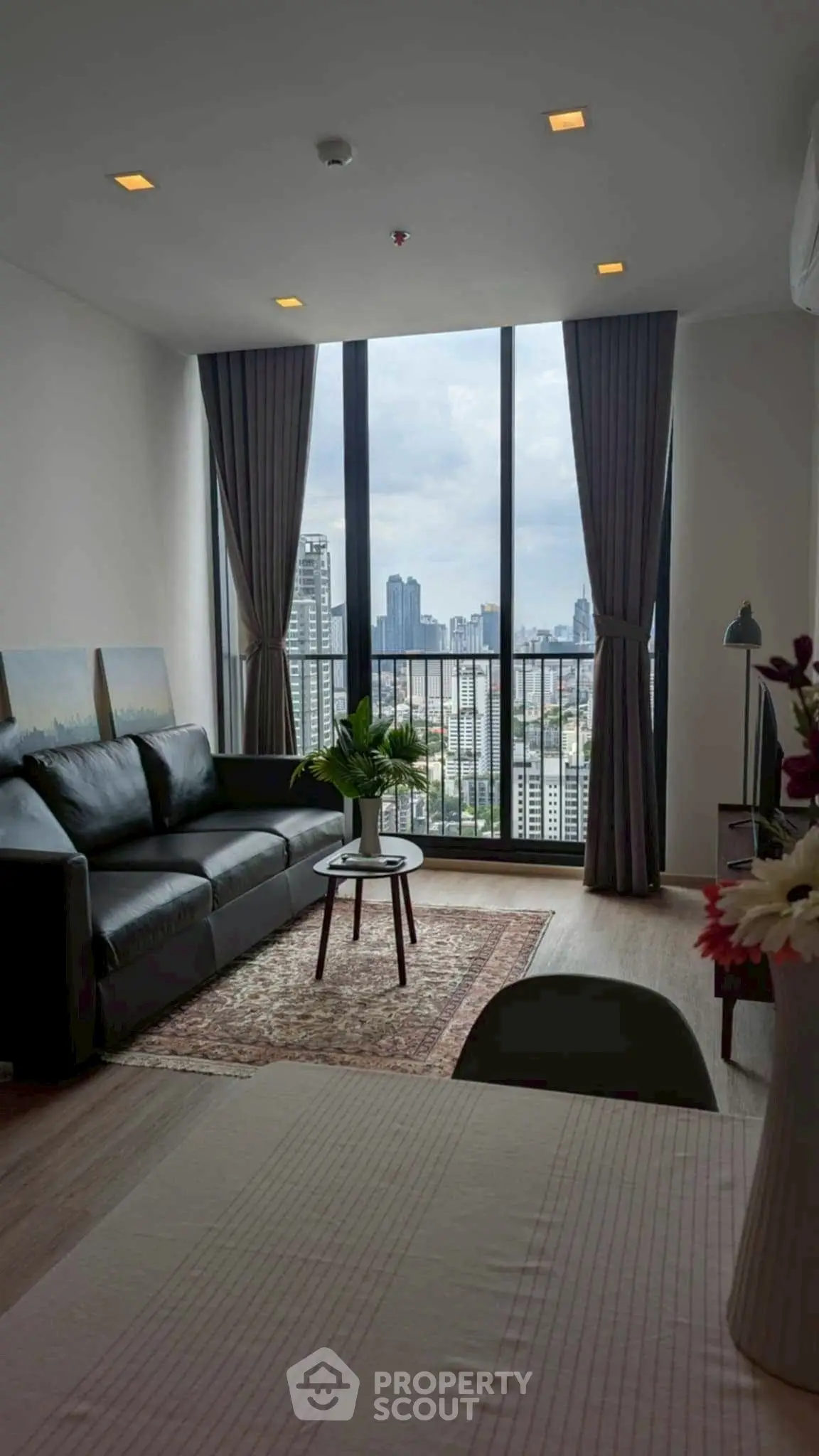 Modern living room with city view and elegant decor