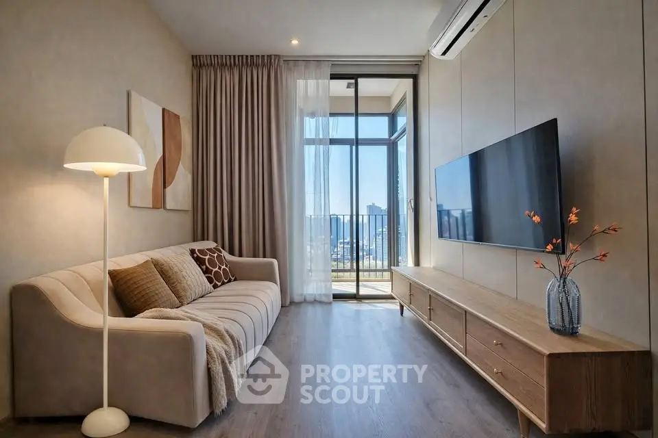 Stylish living room with modern decor and balcony view in luxury apartment