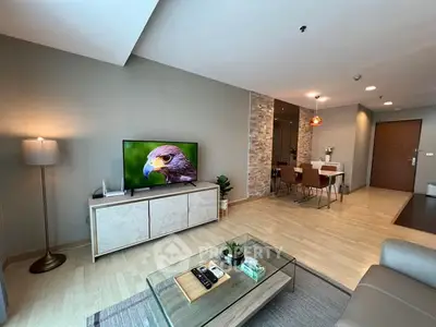 Spacious modern living room with stylish decor and open dining area