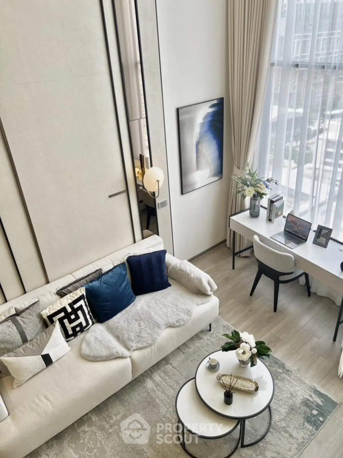 Luxurious modern living room with high ceilings and elegant decor