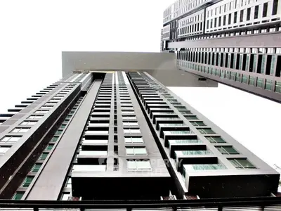 Stunning modern high-rise building with unique architectural design and sleek facade.