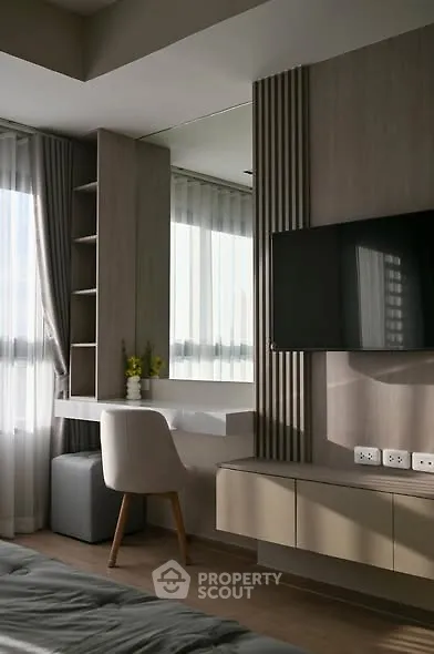 Modern bedroom with stylish decor and natural light
