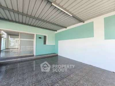 Spacious covered patio with tiled flooring and modern design