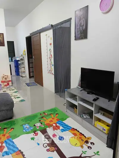 Charming family living room with playful decor and modern entertainment setup.