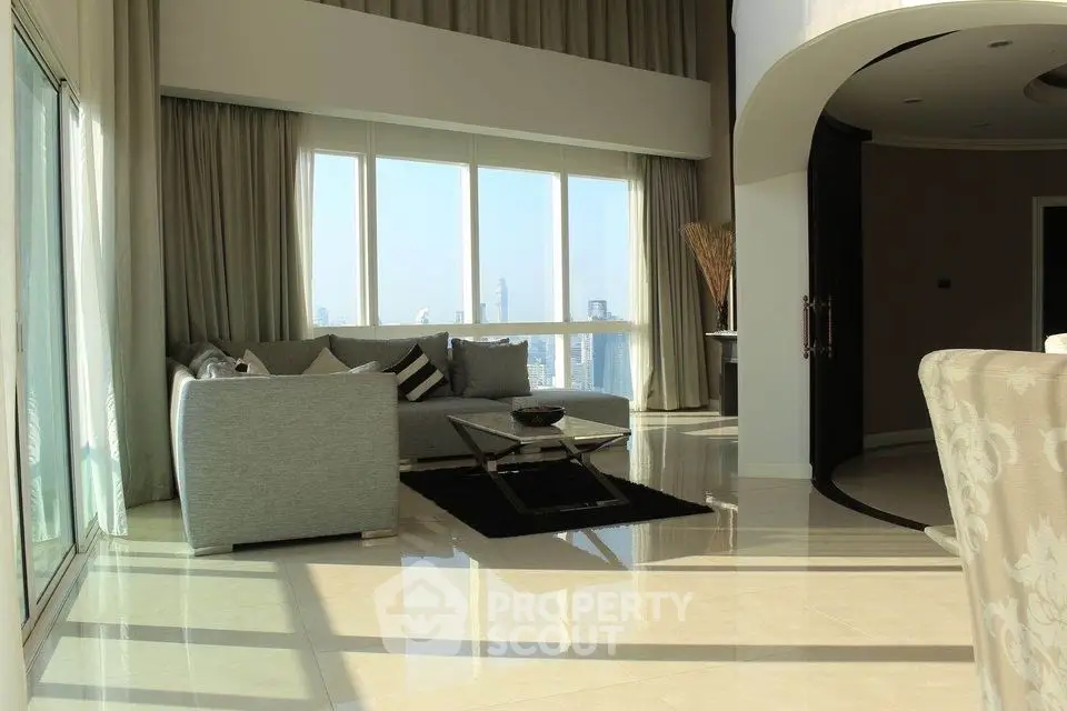 Luxurious living room with panoramic city views and elegant decor