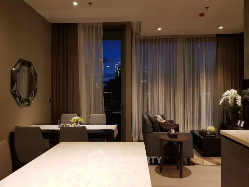 Elegant living room with dining area and modern decor in a high-rise apartment.