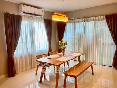 Elegant dining area with natural light and modern wooden furniture