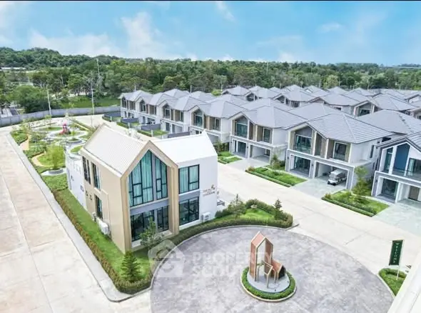 Modern residential community with stylish houses and lush greenery.