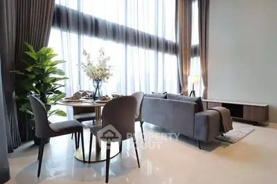 Luxurious modern living room with high ceilings and elegant decor