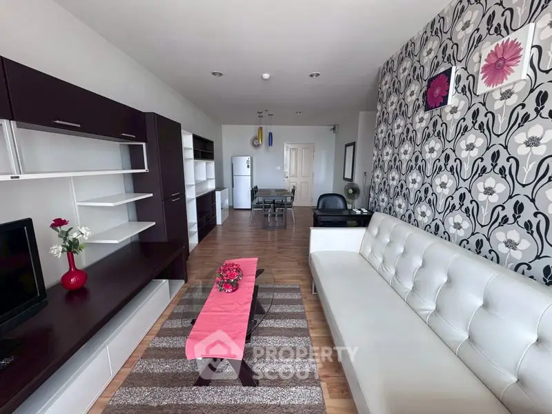 Stylish modern living room with floral accent wall and sleek furniture