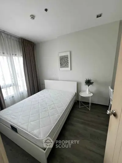 Cozy bedroom with minimalist decor and natural light