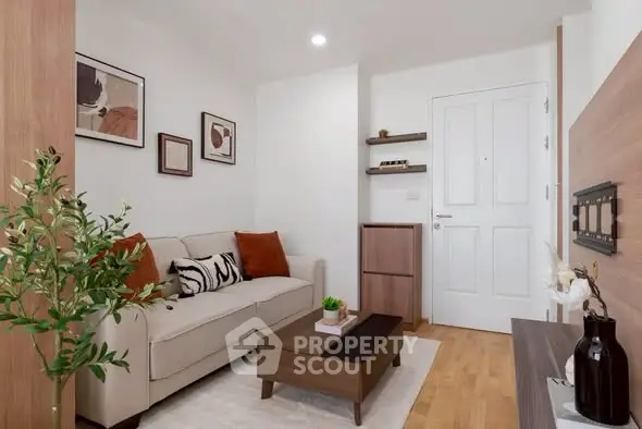 Chic modern living room with cozy sofa, stylish decor, and wooden accents in a compact apartment.