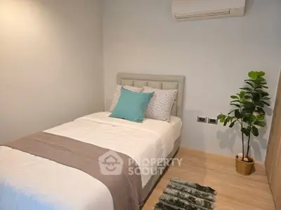 Cozy bedroom with modern decor and air conditioning