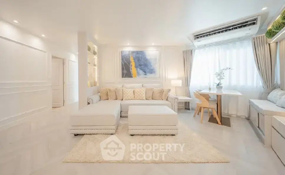 Elegant and spacious living room with modern decor and natural light