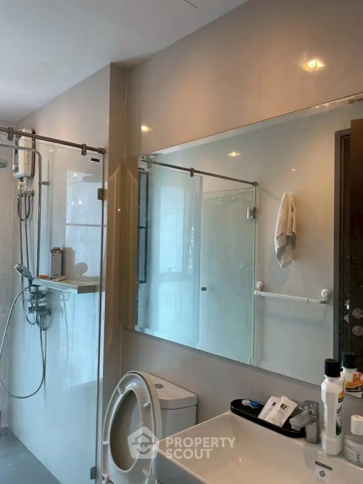 Modern bathroom with glass shower and sleek fixtures