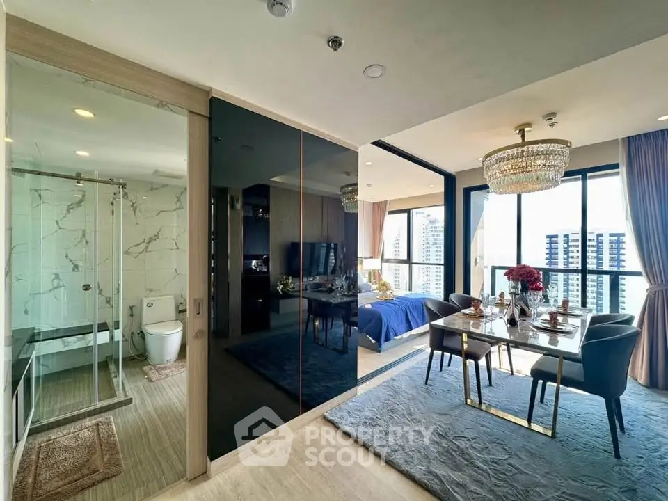 Luxurious modern apartment with open living and dining area, featuring elegant decor and city views.