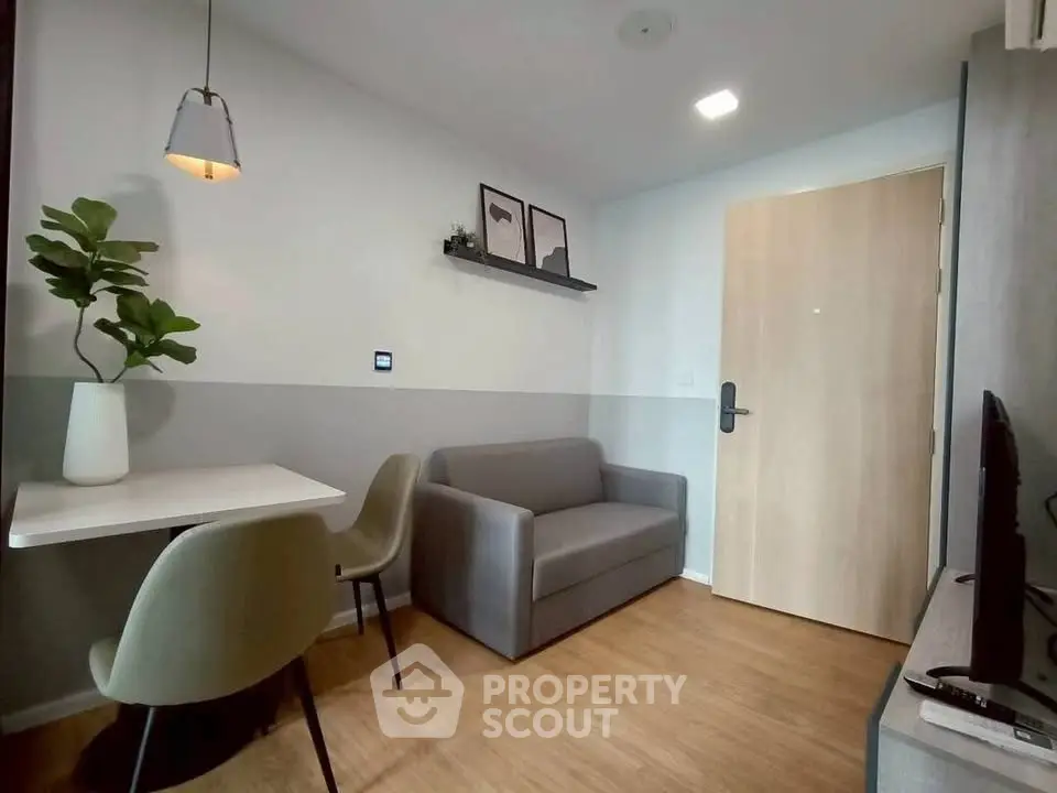 Modern living room with cozy sofa and dining area, perfect for urban living.