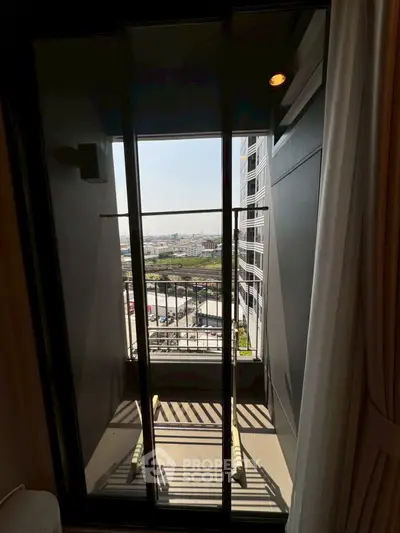 Chic urban balcony with stunning city view, perfect for modern living.