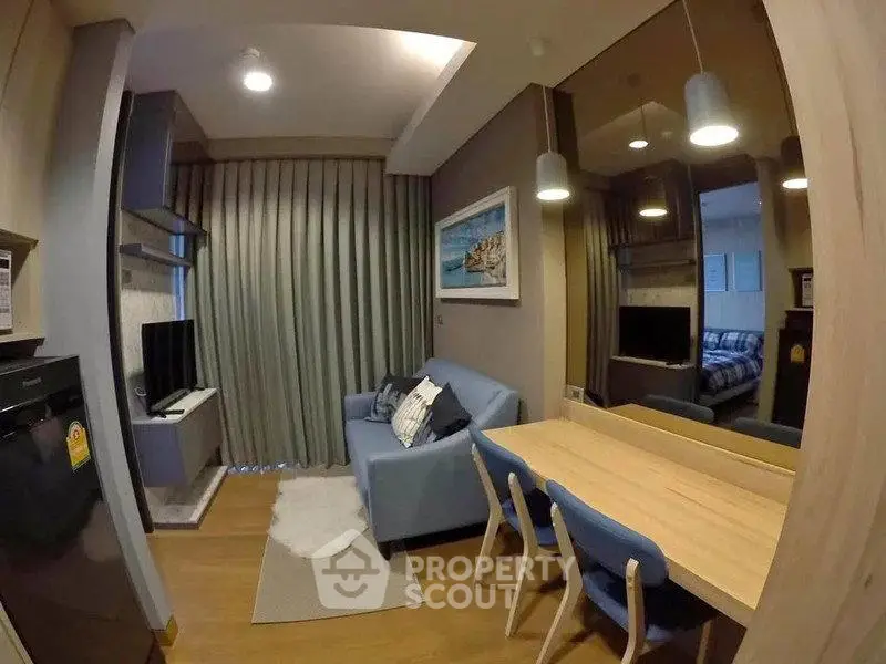 Cozy living room with modern decor and dining area in stylish apartment