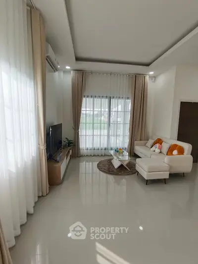 Spacious modern living room with elegant decor and natural light