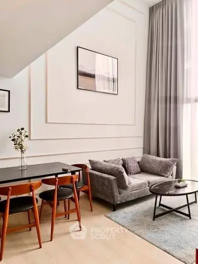 Stylish modern living room with high ceilings and elegant decor
