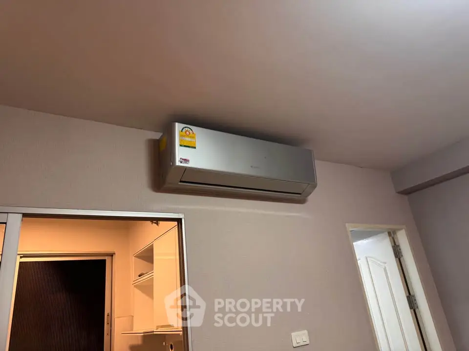 Modern air conditioning unit in a cozy apartment interior