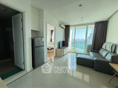 Modern apartment living room with city view and sleek furnishings