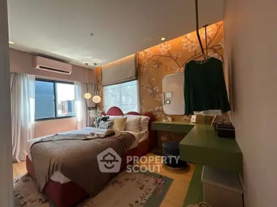 Elegant bedroom with floral wallpaper and modern decor