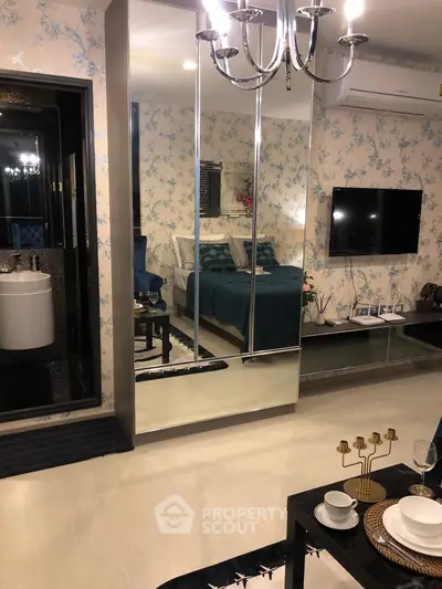 Luxurious bedroom with mirrored wardrobe and elegant decor