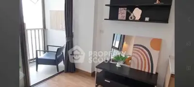 Stylish modern living room with balcony access and chic decor