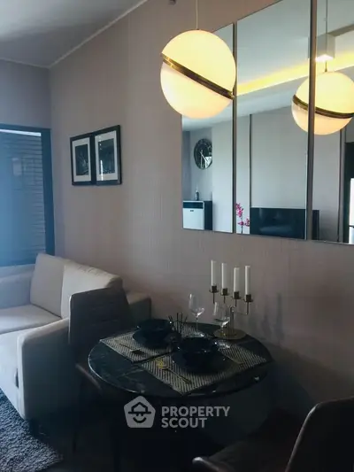 Stylish modern living room with elegant dining area and chic lighting