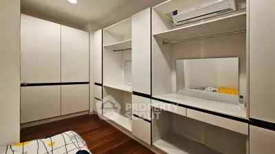 Spacious walk-in closet with modern shelving and ample storage space.