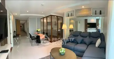 Spacious modern living room with elegant decor and open layout, perfect for entertaining.