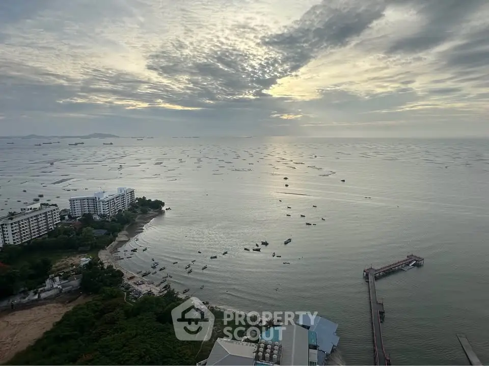 Stunning ocean view from high-rise building with serene seascape and distant ships.