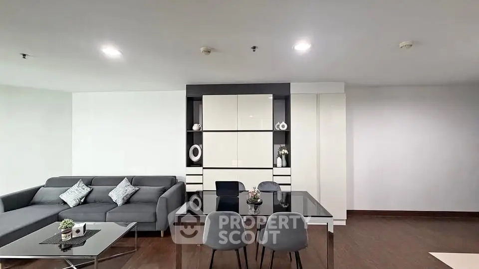 Modern living room with sleek furniture and elegant decor in a contemporary apartment.