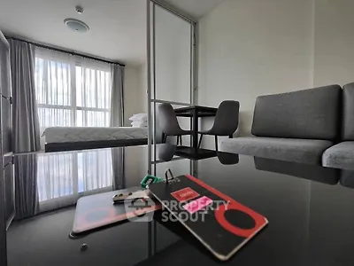 Modern studio apartment with sleek furniture and natural light