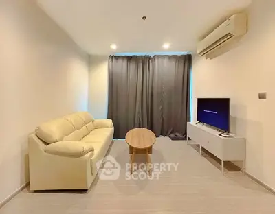 Modern living room with cozy sofa and air conditioning