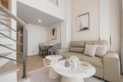 Modern living room with stylish decor and cozy seating area in a contemporary apartment.
