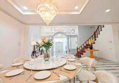 Luxurious dining room with elegant chandelier and stylish decor