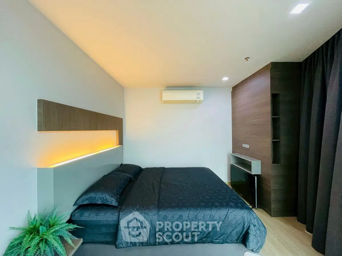 Modern bedroom with sleek design and ambient lighting