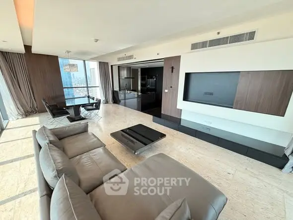 Luxurious modern living room with panoramic city views and elegant furnishings.