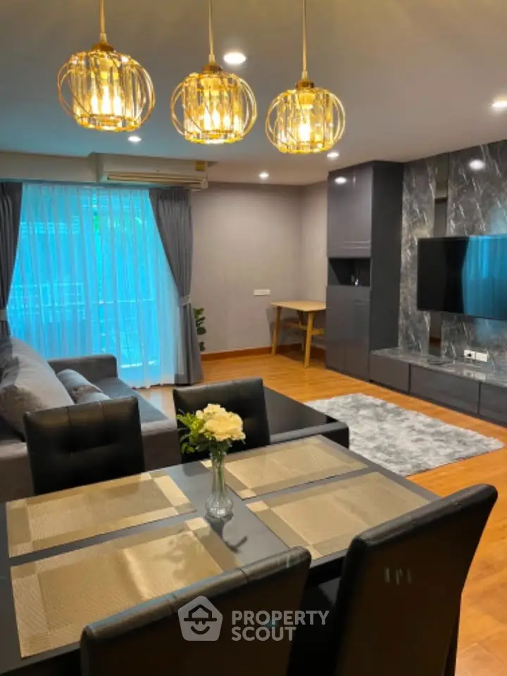 Modern living room with elegant lighting and stylish decor in a cozy apartment.