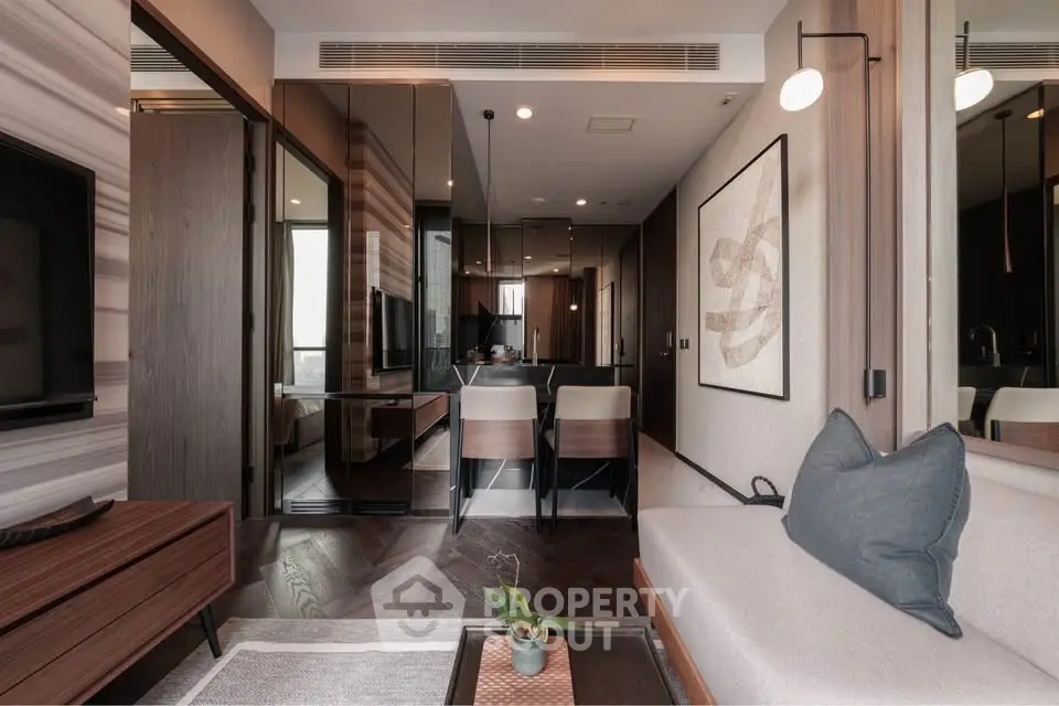 Modern living room with sleek design and elegant dining area in luxury apartment.