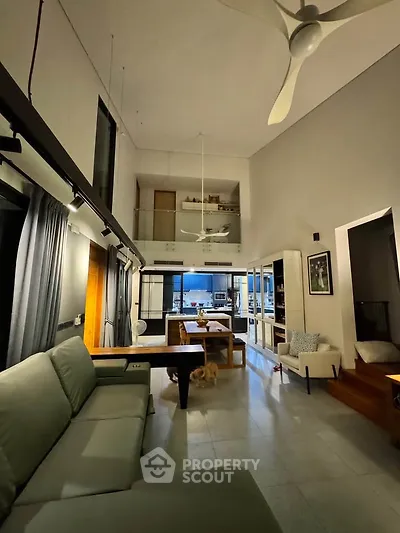 Spacious modern living room with high ceilings and stylish decor