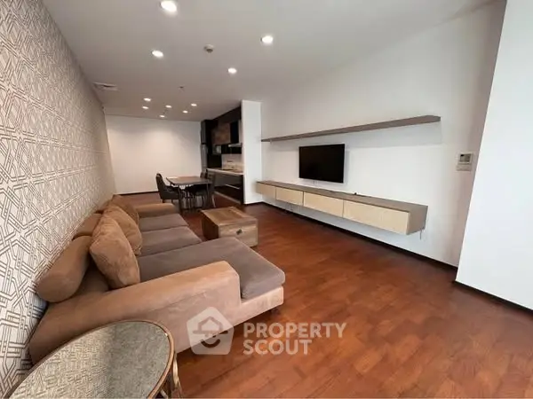 Spacious modern living room with elegant decor and open kitchen layout