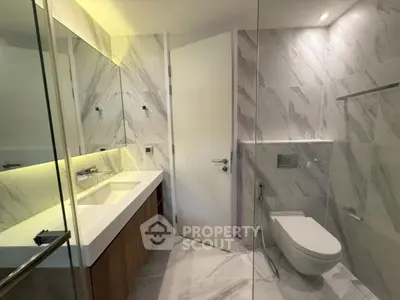 Luxurious modern bathroom with elegant marble tiles and sleek fixtures