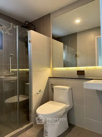 Modern bathroom with glass shower and sleek fixtures