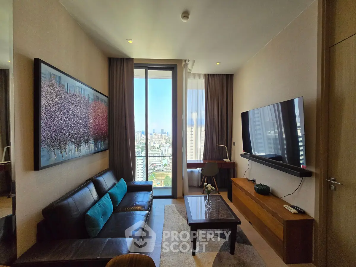 Luxurious living room with city view, modern decor, and large wall art in high-rise apartment.