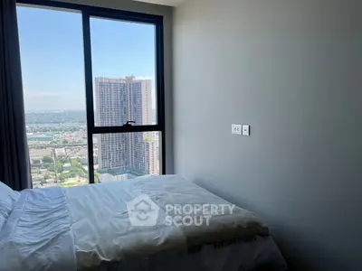 Modern bedroom with stunning city view from high-rise window